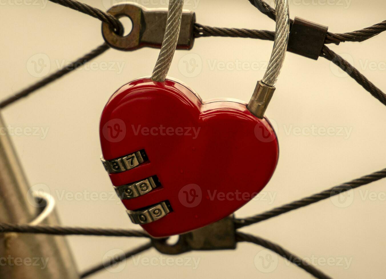 Heart lock at the bridge, red heart lock with a code, love and passion photo. A password from my heart concept photo