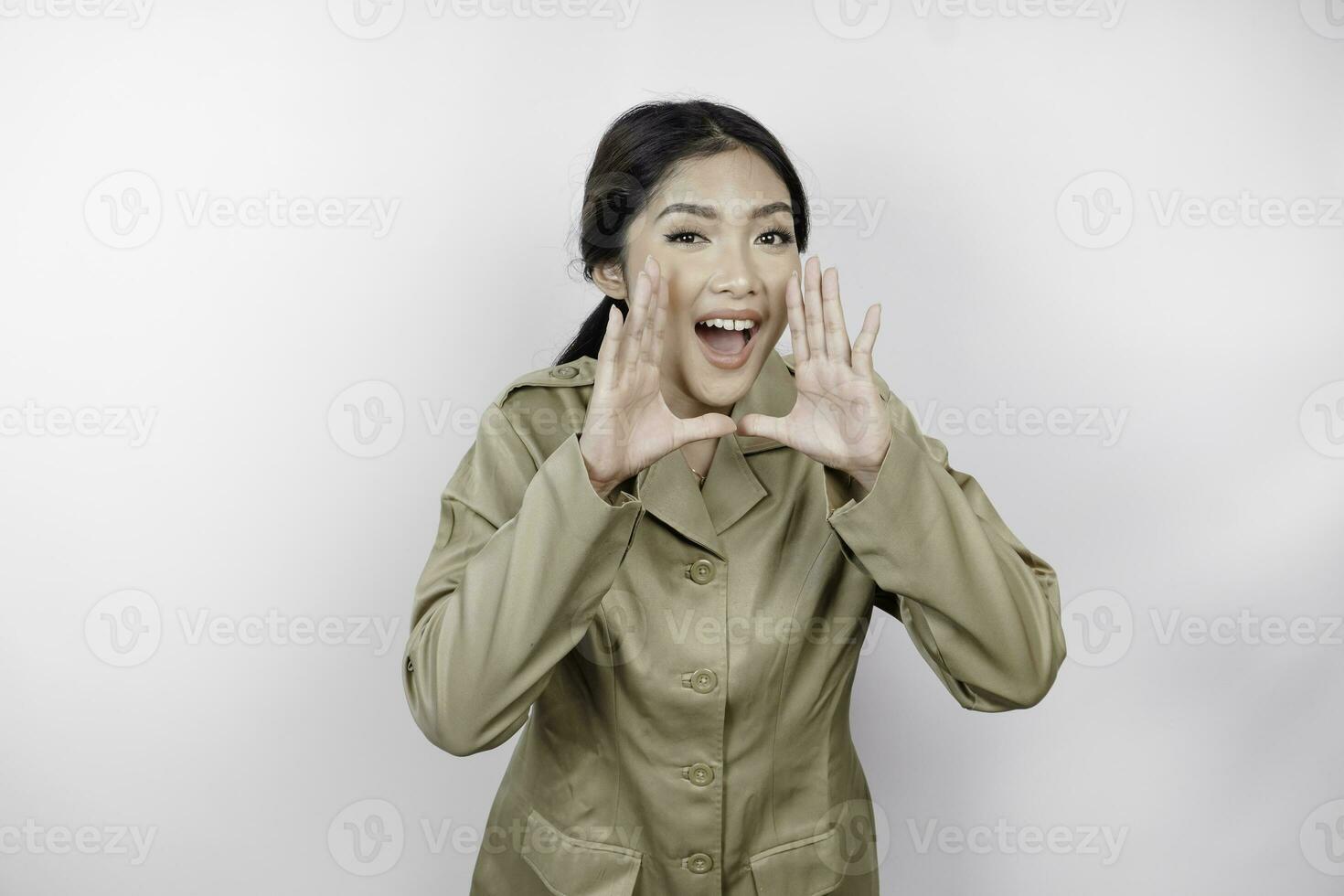 Young beautiful civil worker woman is shouting or yelling isolated by a white background. Communication concept photo
