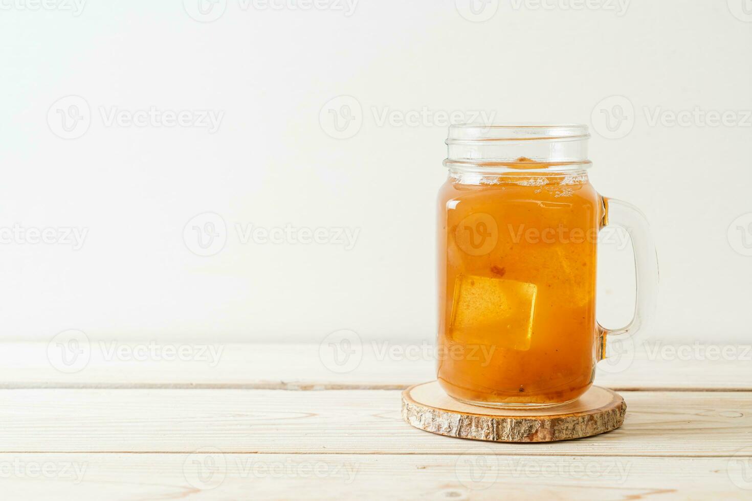 Delicious sweet drink tamarind juice and ice cube photo