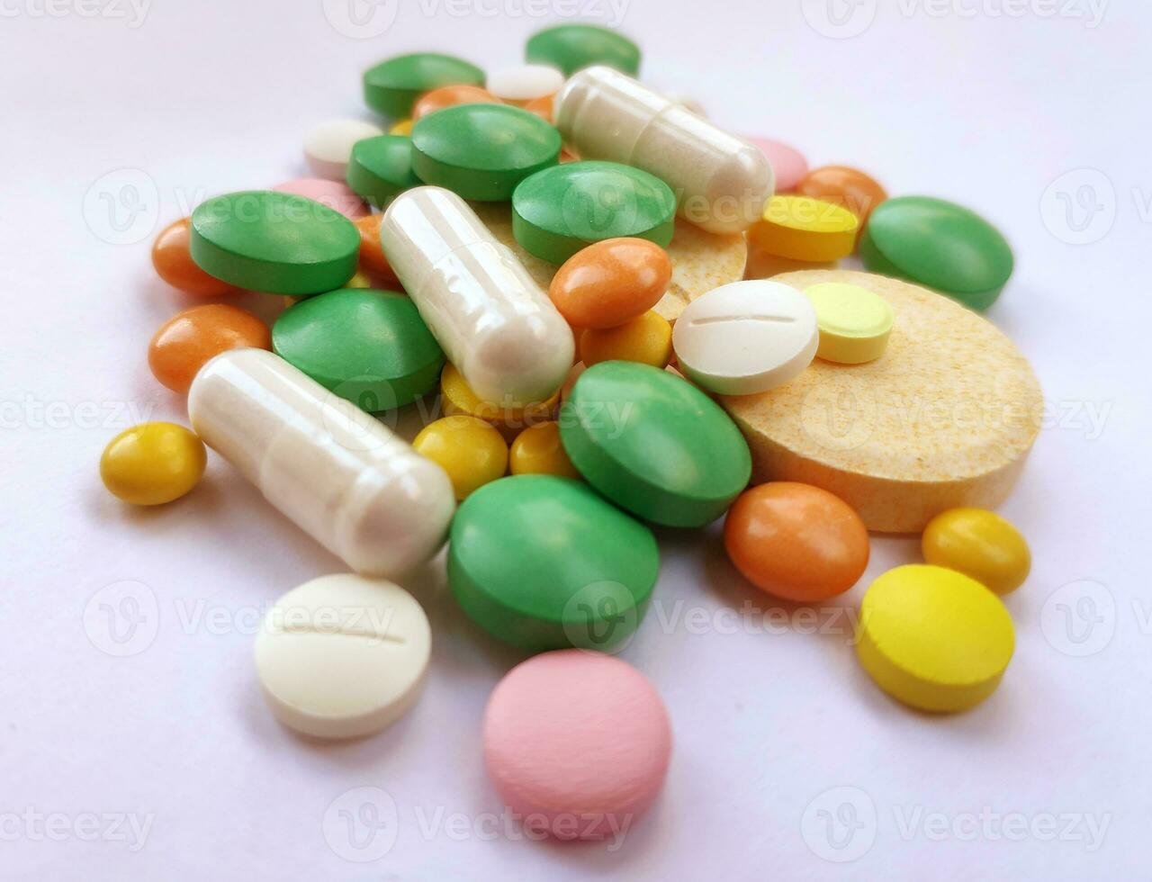 Stack of colourful pills, medicine background photo