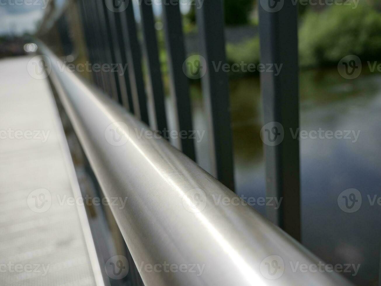 Bridge handrail with blurred abstract background, ancient bridge over the river backgroun photo