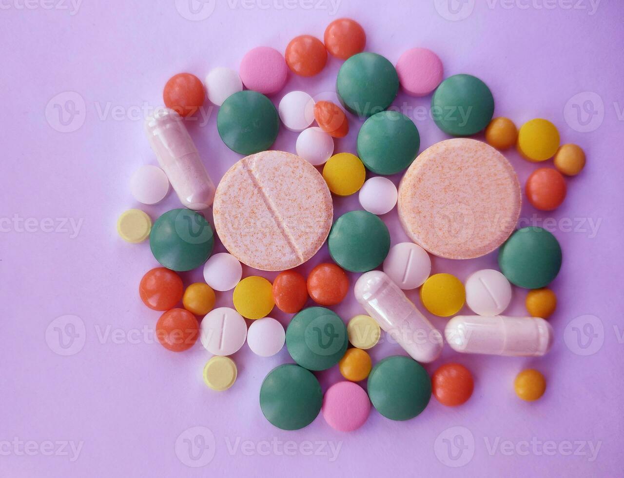 Stack of colourful pills, medicine background photo