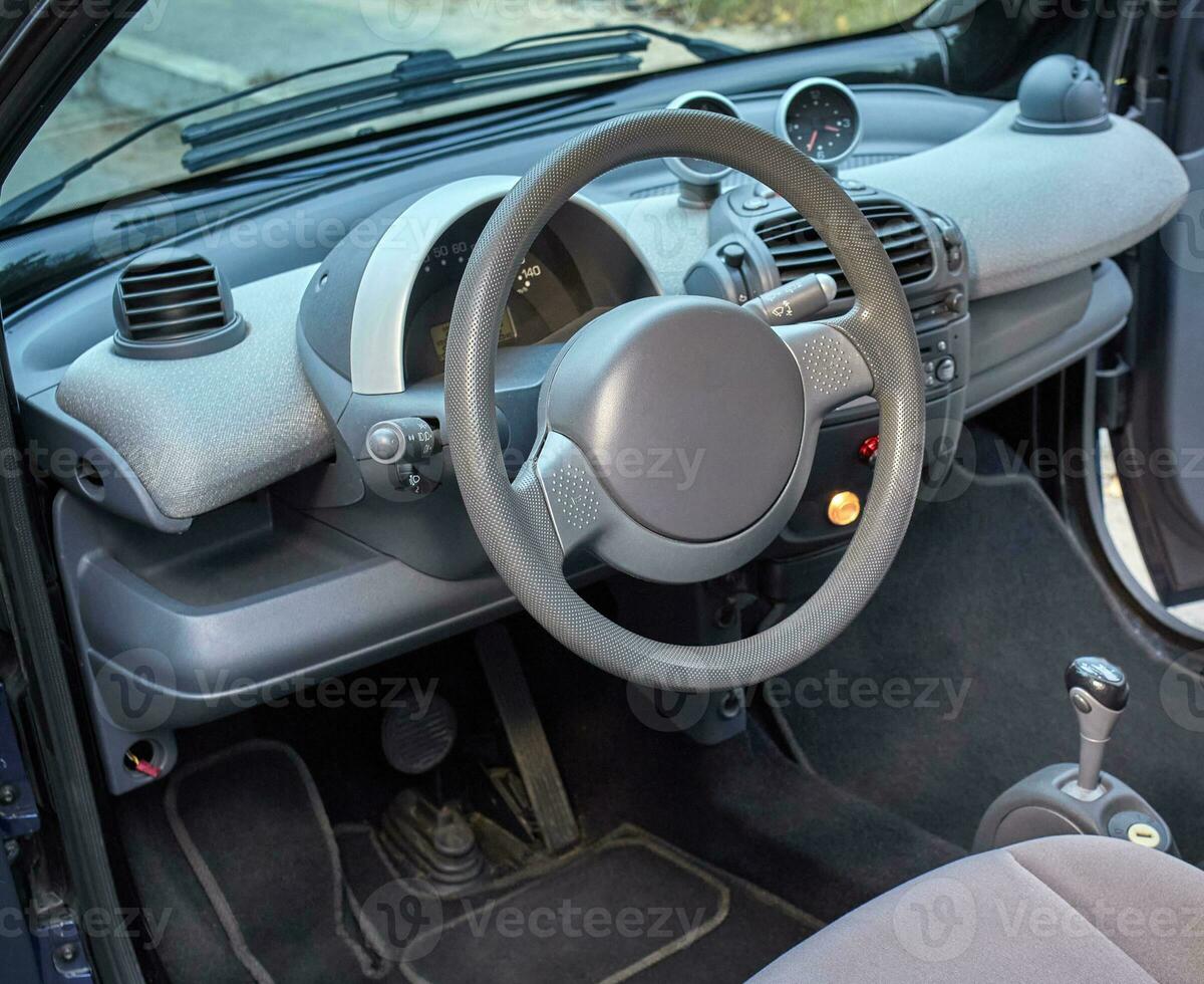 Car steering wheel and interior background, modern city car elements close view. Car inside interior photo