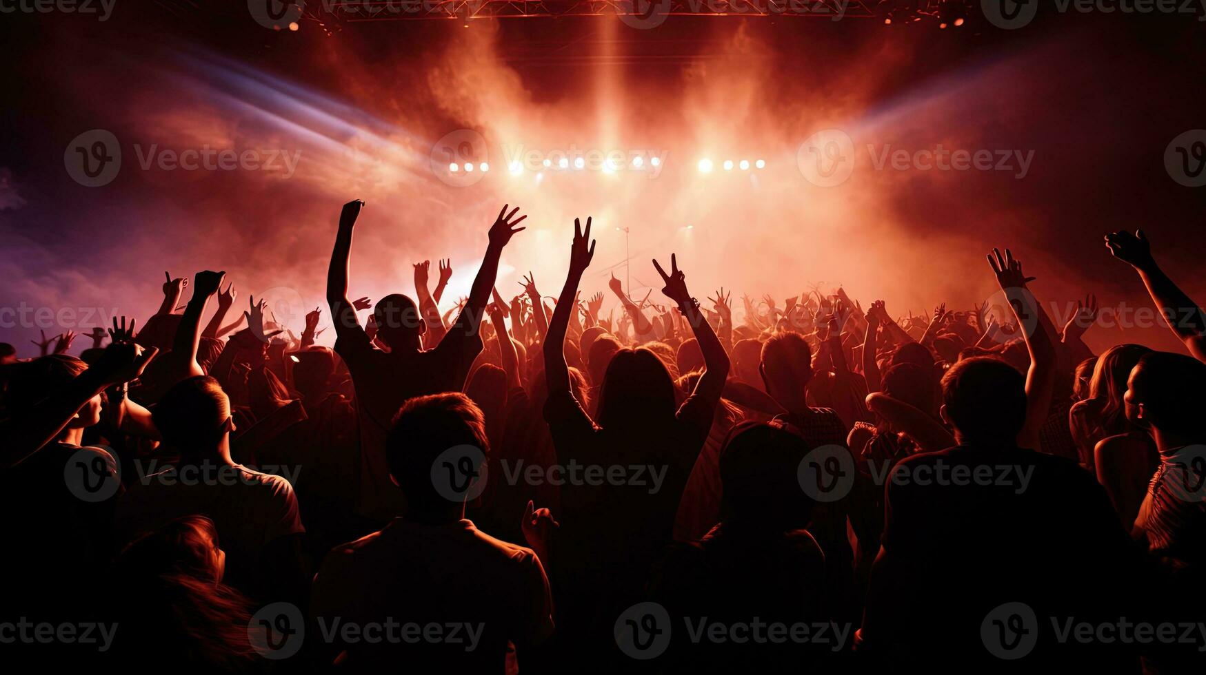 crowd cheering in front of stage lights. silhouette concept photo