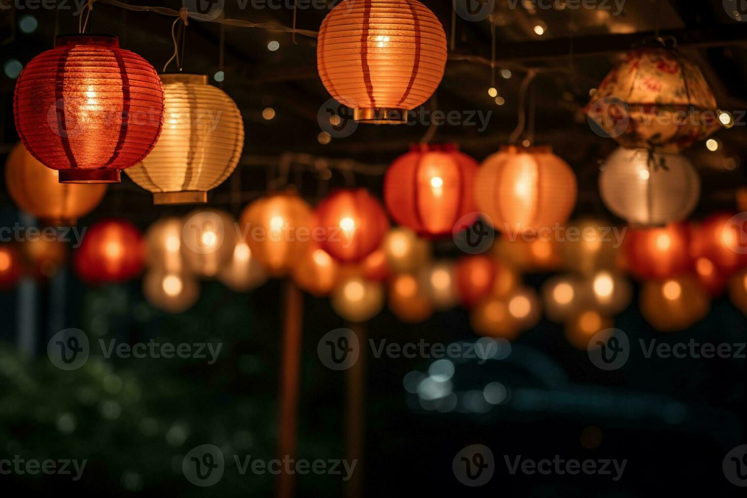 colorful paper lanterns hanging from a wooden structure photo
