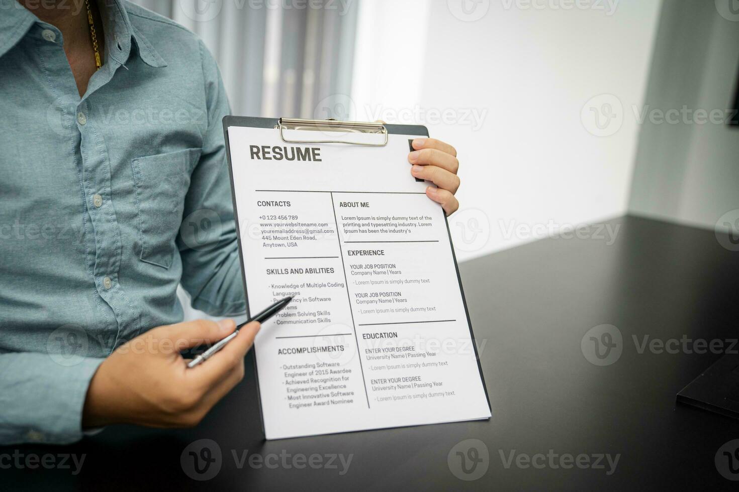 Examiner reading a resume during job interview at office Business and human resources concept. photo