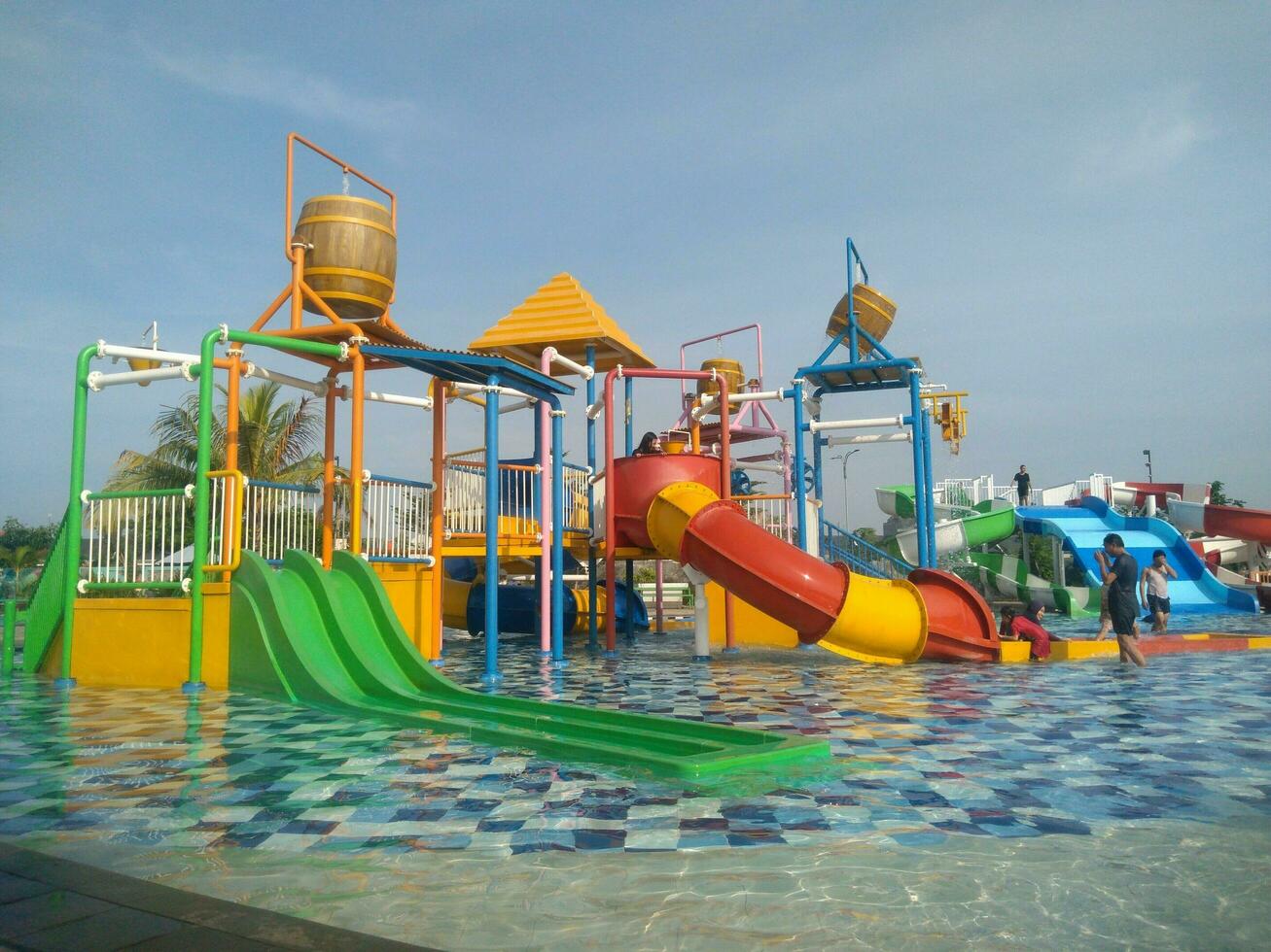 Water boom Swimming Pool in the morning under the blue sky photo