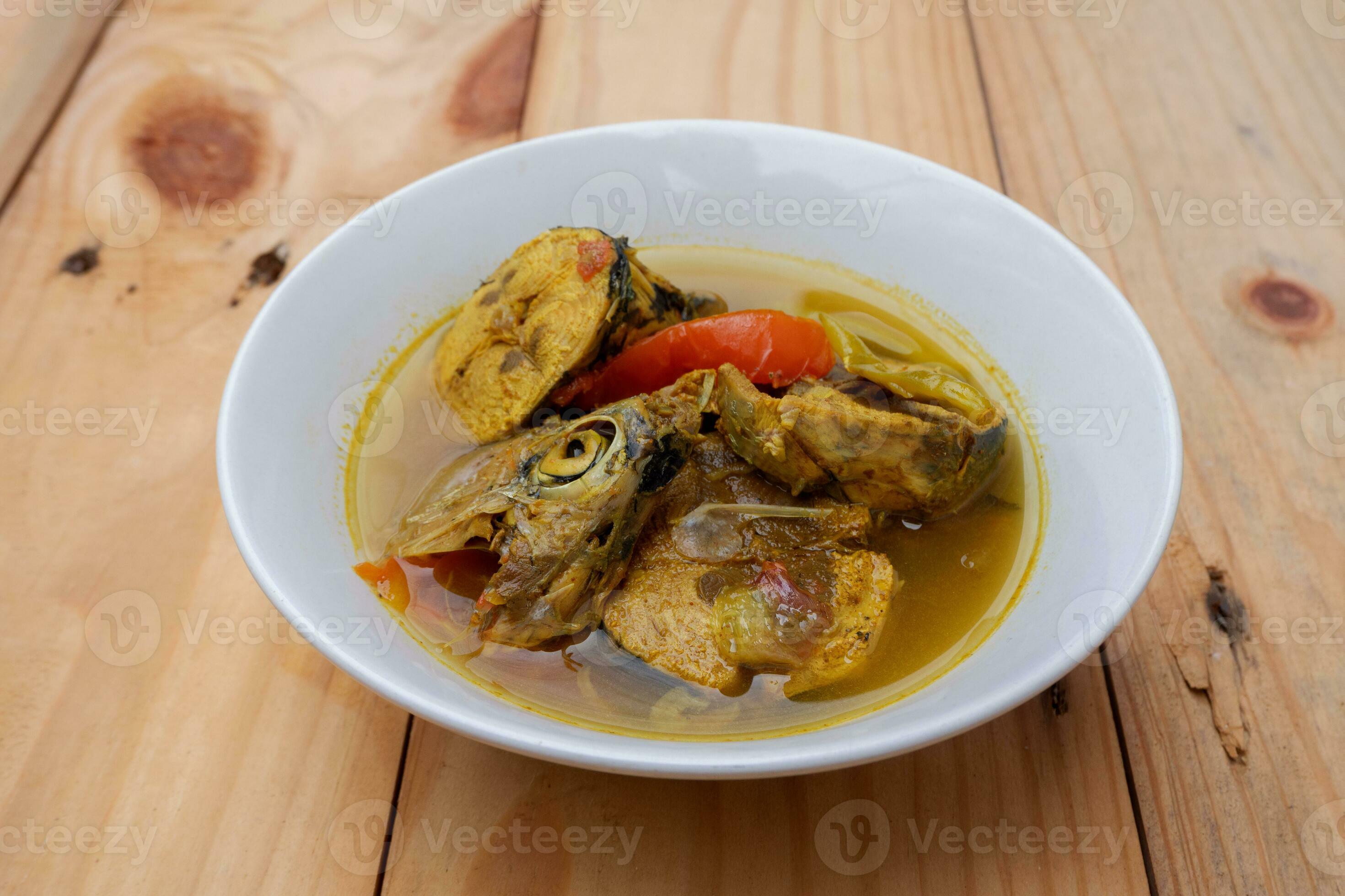 Tuna fish head soup with yellow turmeric sauce 27453258 Stock Photo at