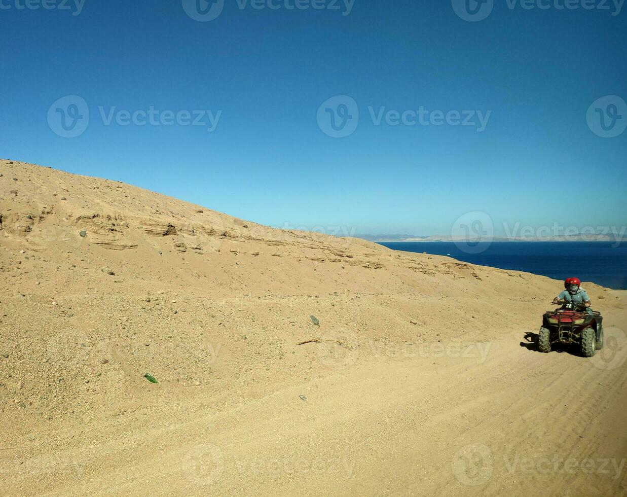 Riding a quad bike in Egypt photo