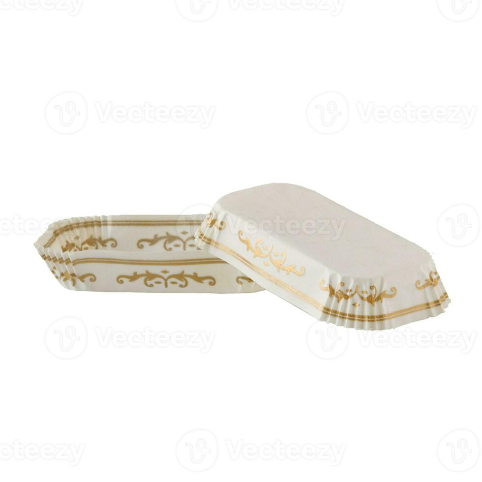 White paper baking form for eclairs and cakes with golden pattern photo