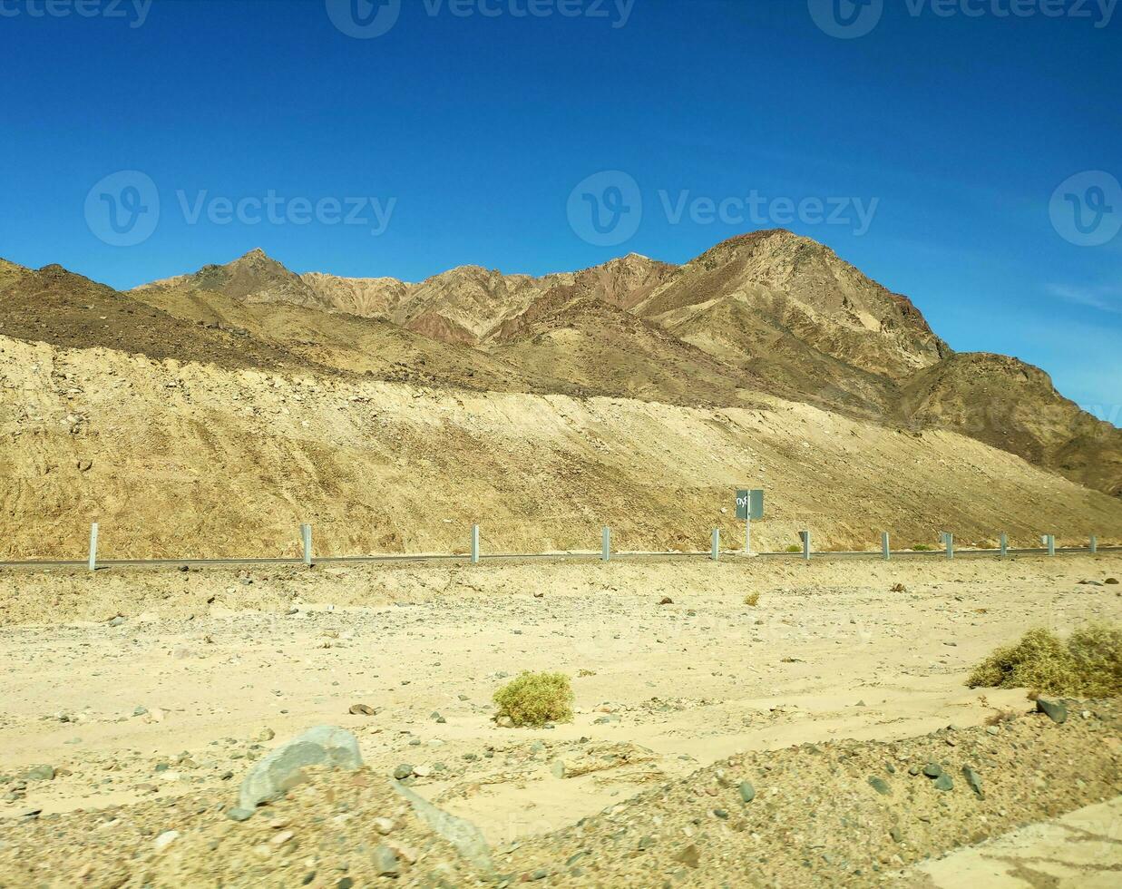 Road going through Sinai mountains, hills and desert photo