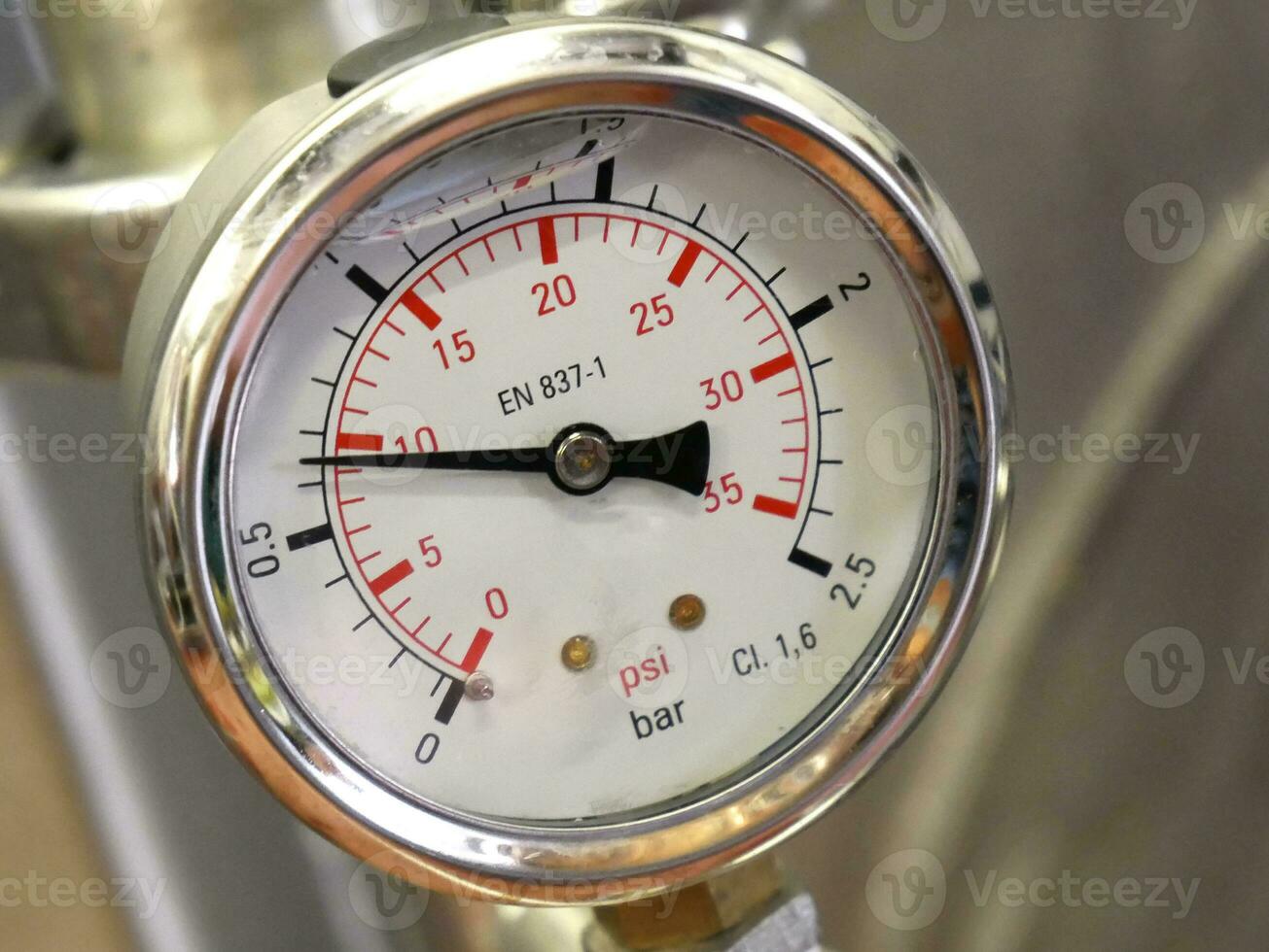 Pointer indicator of pressure on the industrial whiskey distiller construction, pipes and sensors, industrial production factory interior background photo