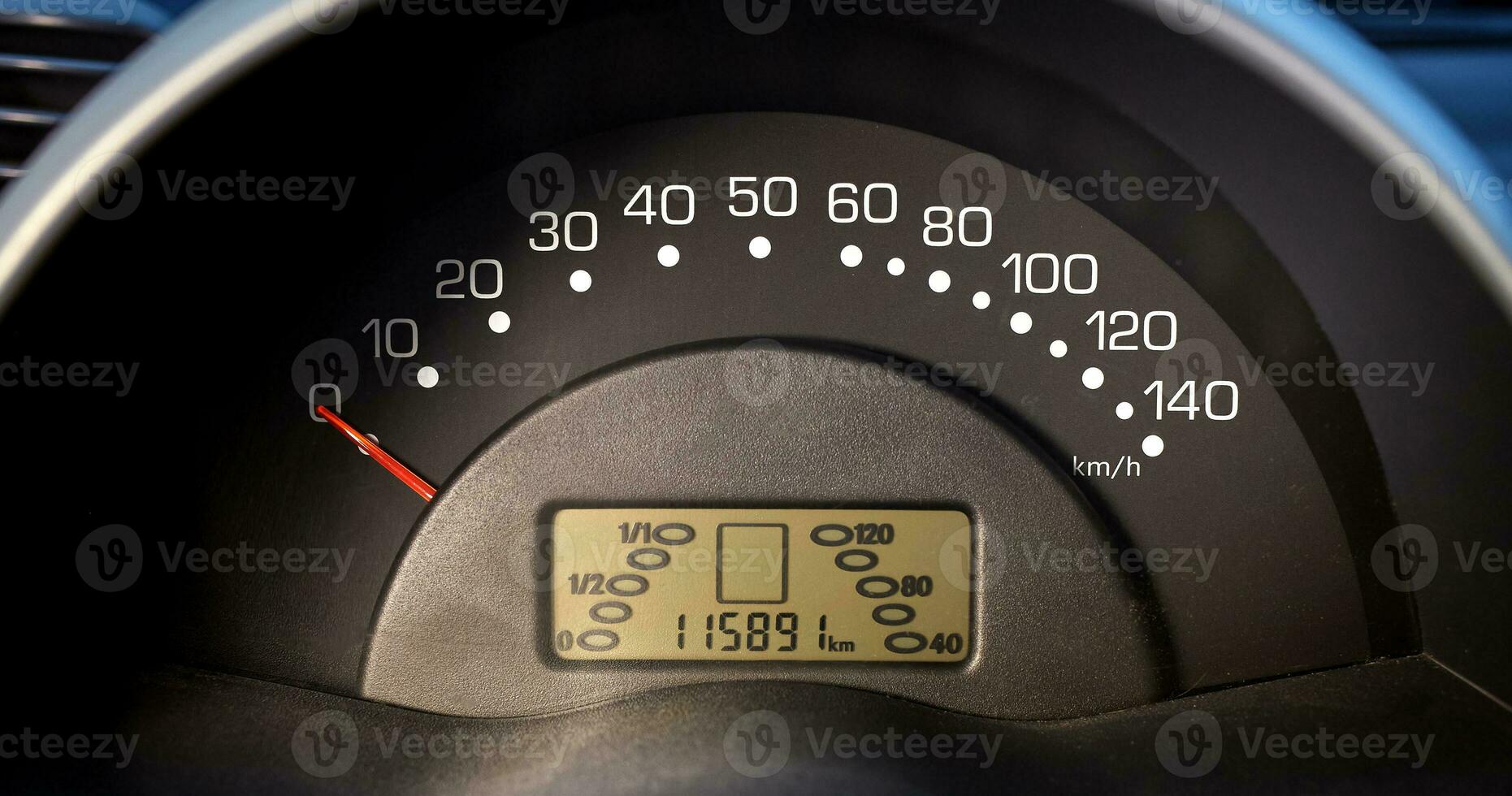 Car speedometer and sensors on a control panel background, car elements close view photo