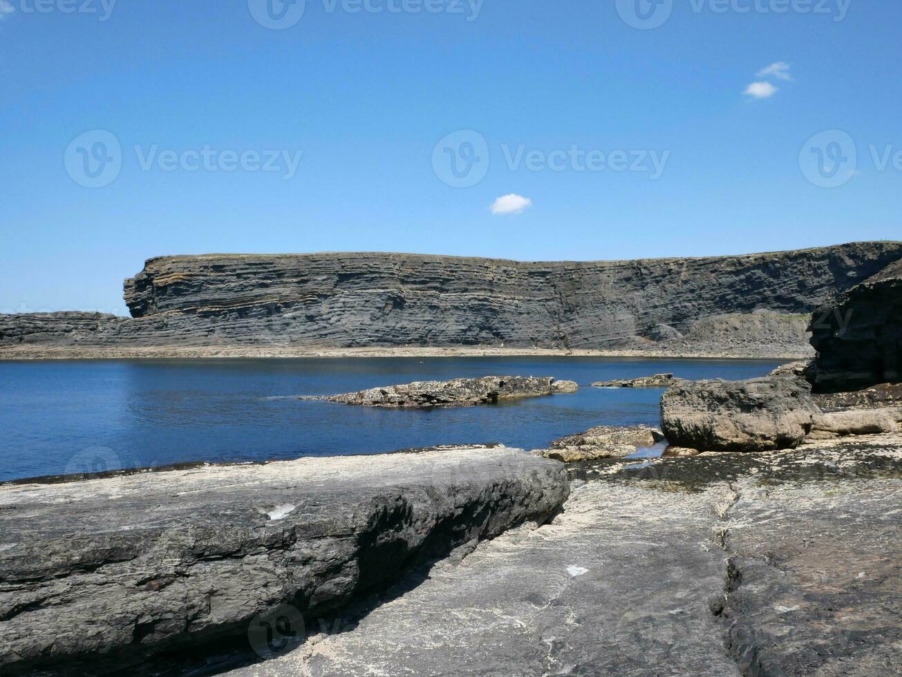 Cliffs and Atlantic ocean, clouds, rocks and laguna, beauty in nature. Vacation trip relaxation background photo