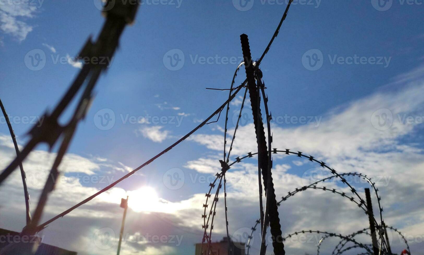 Barbed wire fence, prison and freedom conceptual background photo