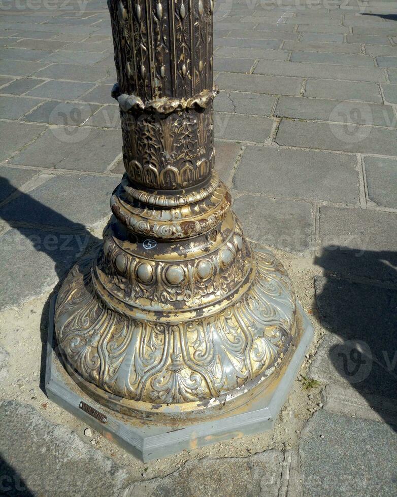 Old bronze column in Paris, France photo