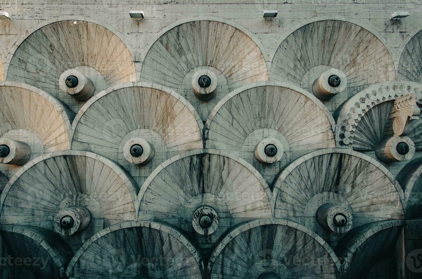 Modern fountain with the circular wheels form stones concept photo. photo