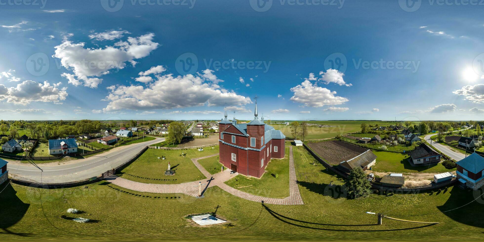 full hdri 360 panorama aerial view on wooden neo gothic catholic church in countryside or village in equirectangular projection with zenith and nadir. VR  AR content photo