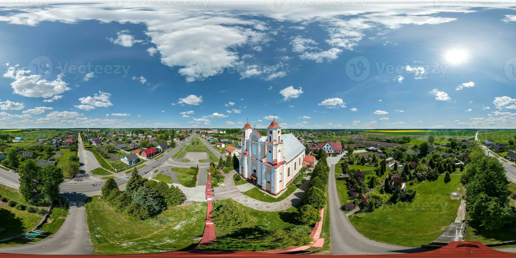 full hdri 360 panorama aerial view on red brick neo gothic or baroque catholic church in countryside or village in equirectangular projection with zenith and nadir. VR  AR content photo