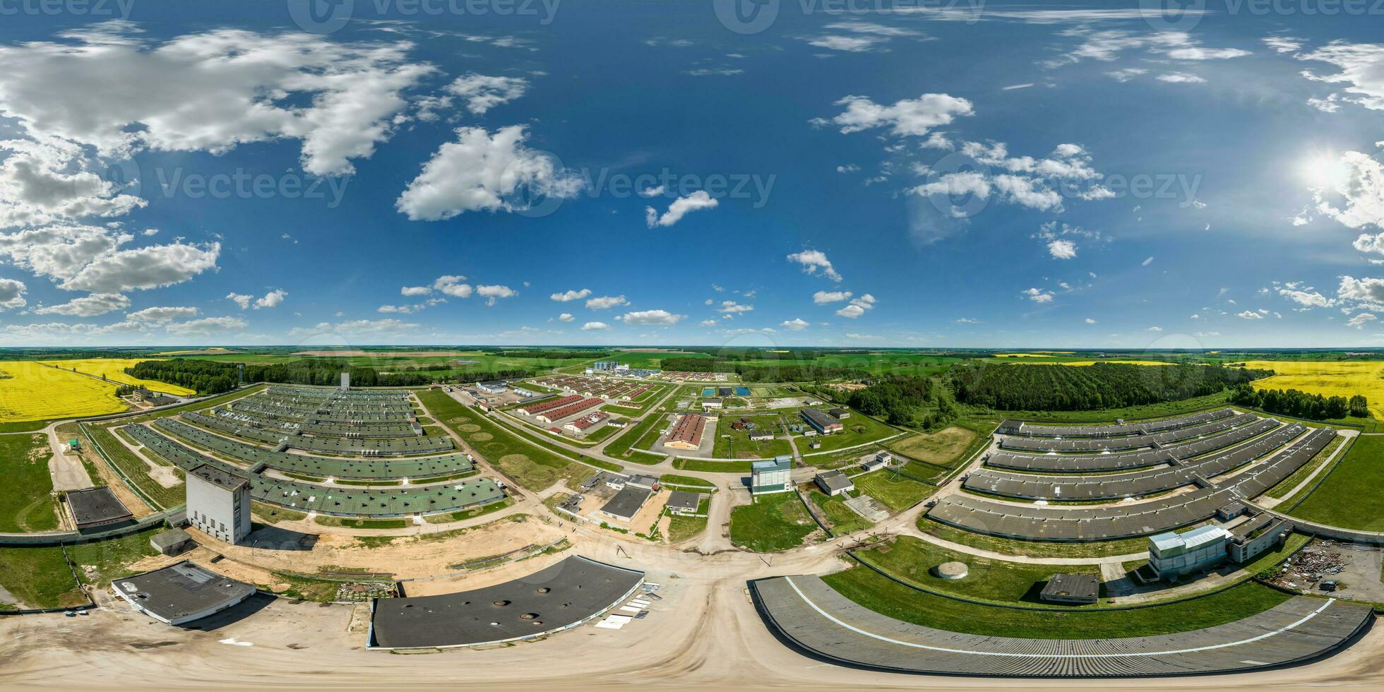 aerial seamless 360 hdri panorama view over rows of agro farms with silos and agro-industrial livestock complex in equirectangular spherical projection photo