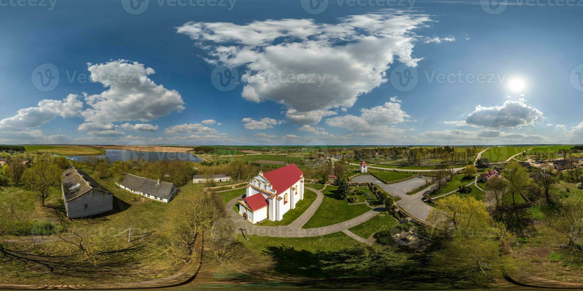 full hdri 360 panorama aerial view on red brick neo gothic or baroque catholic church in countryside or village in equirectangular projection with zenith and nadir. VR  AR content photo