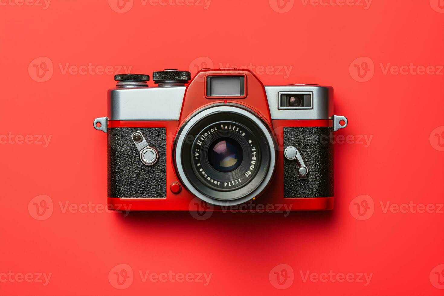 Retro camera isolated on red background. Flat lay, top view photo