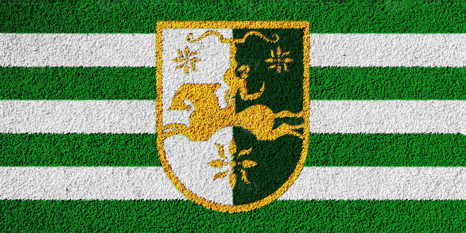 Flag and coat of arms of Republic of Abkhazia on a textured background. Concept collage. photo