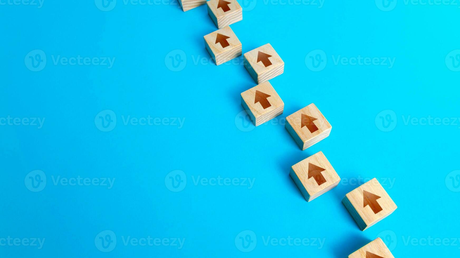Chain of arrows blocks. Consistency and focus. Concept of conformism, vertical of power. Unchanging course of development. Moving forward. Step by step process. Education and skill growth. photo