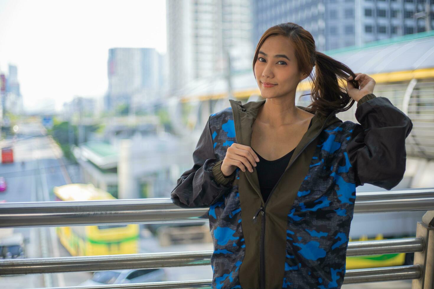 Sporty woman stretching and warming up for running urban fitness winter workout. Sport and healthy lifestyle concept. photo