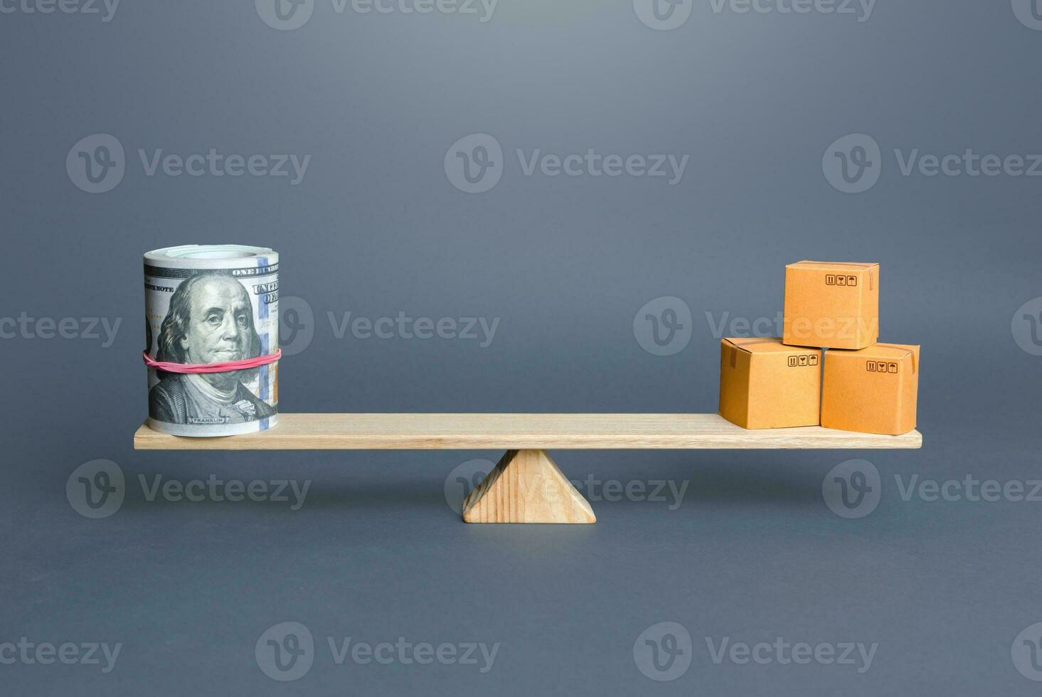 Dollars bundle and boxes on scales. Trade balance and purchasing power. Commerce and business. Trade of goods and services. Foreign money exchange inflow into the country, economic growth, enrichment. photo