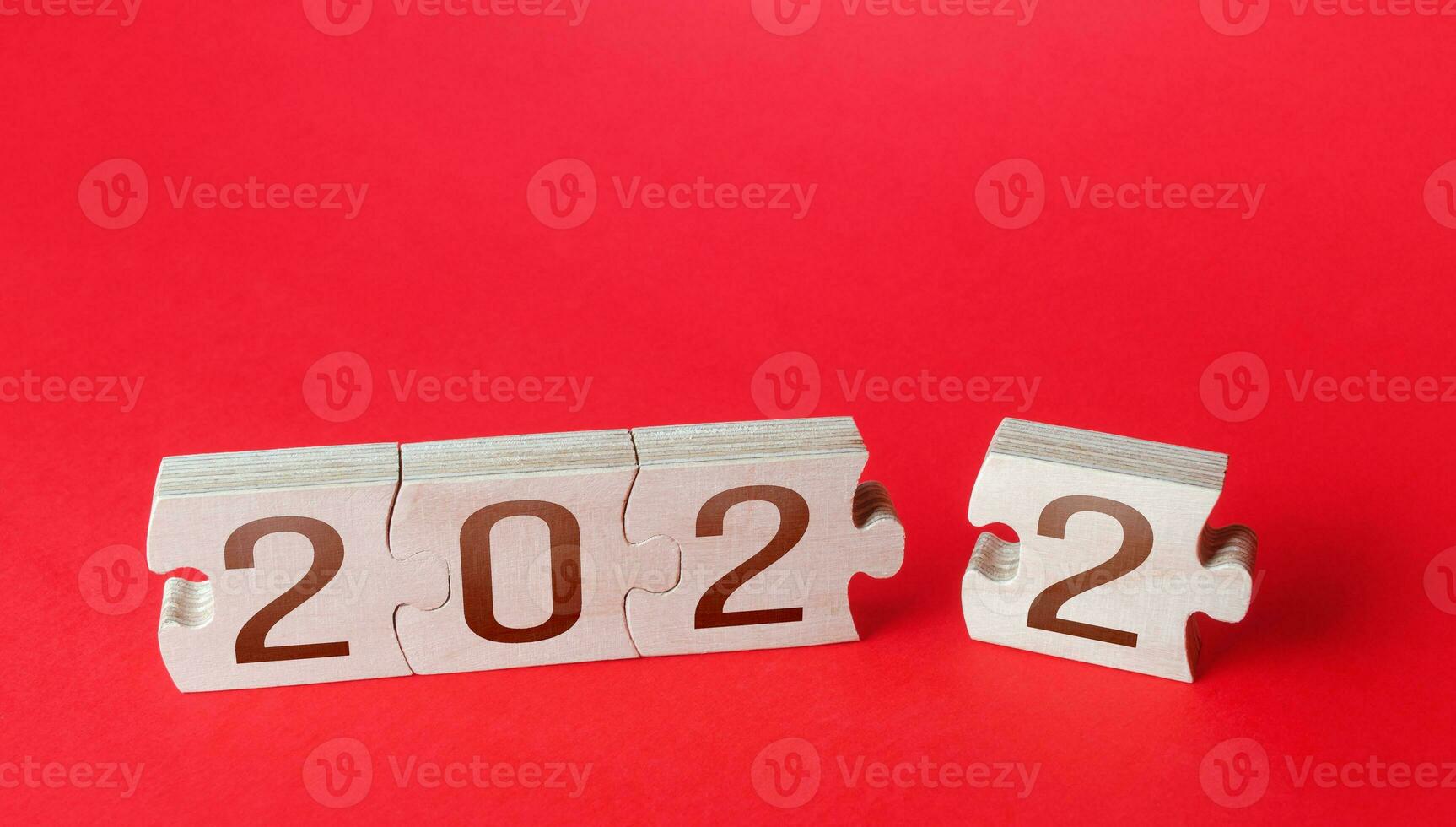 Puzzles and 2022. The beginning of a new year, opening up new opportunities and horizons. Trends and ideas. Holidays and Christmas. Business financial planning. Budget implementation. Forecast photo