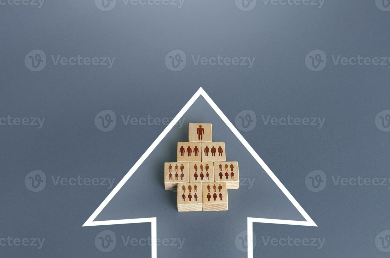 A hierarchical group of people blocks a single formation in an arrow. Unification to achieve the goal. Organization cooperation. Strength in unity, teamwork. Leader, leadership qualities skills photo