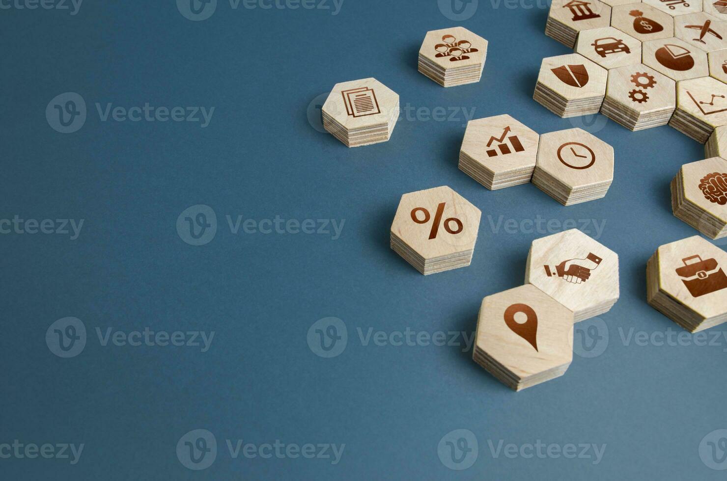 Wooden figurines with business attributes. Components for building a successful company and career growth. Management. Improving the investment climate, attracting investors. Business education. photo