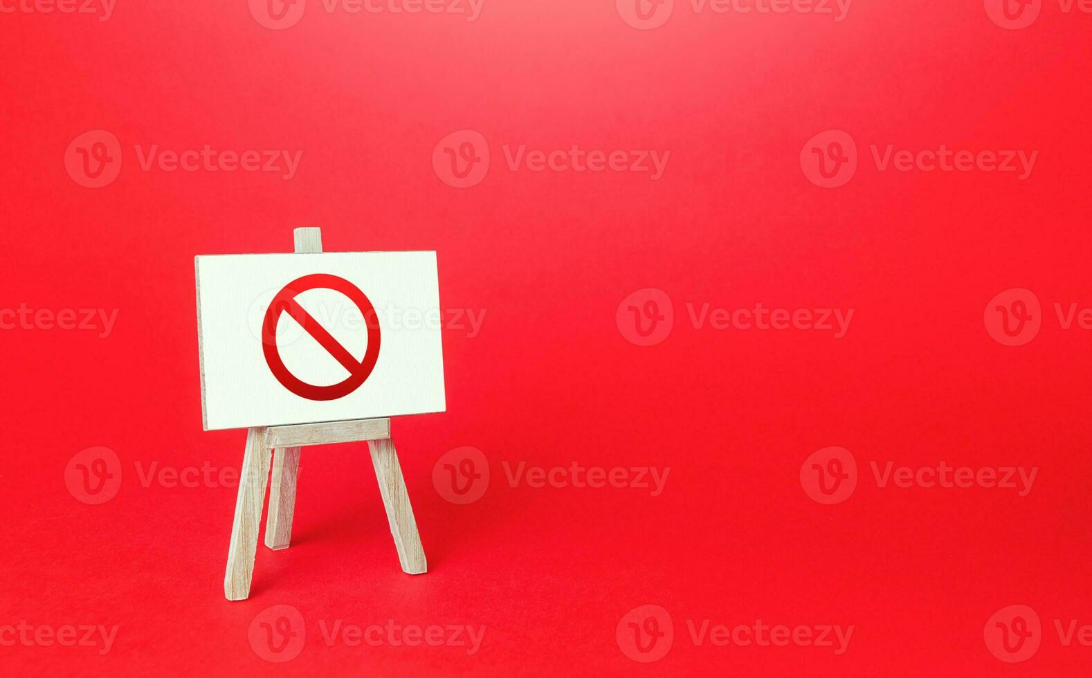 Prohibition sign NO easel on red background. No access, restricted area. Absence of something. Sanction restrictions. Ban, Embargo. Denying, stopping. Reaching Limits. Restrictive measures. Full sale photo