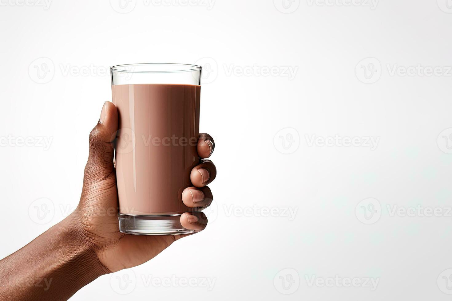 Hand holding a glass of delicious chocolate milk isolated on white background with copy space. ai generated photo