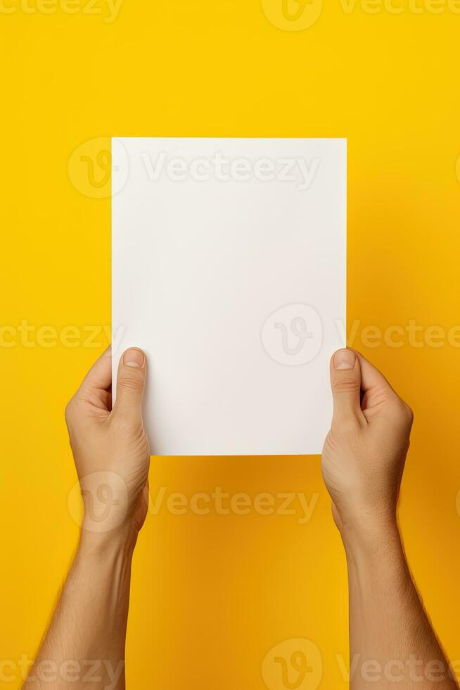 A human hand holding a blank sheet of white paper or card isolated on yellow background. ai generated photo