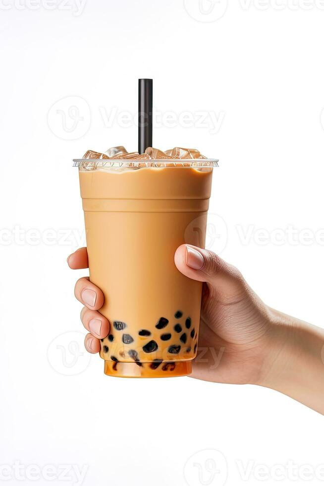A hand holding takeaway plastic cup of delicious iced bubble milk tea and black pearls isolated on white background. ai generated photo