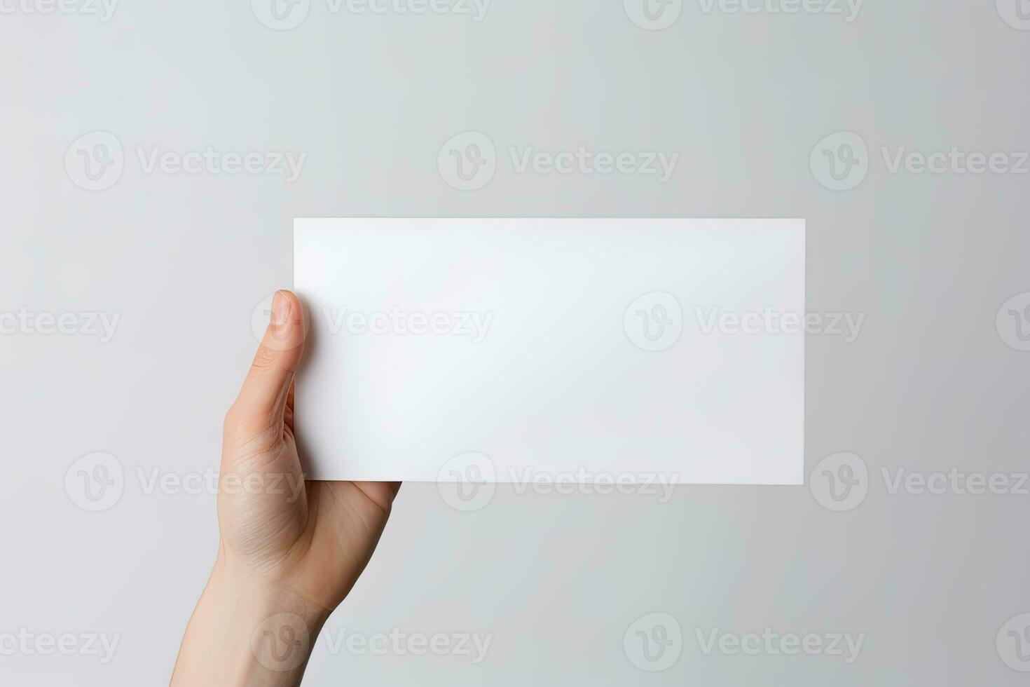 A human hand holding a blank sheet of white paper or card isolated on white background. ai generated photo