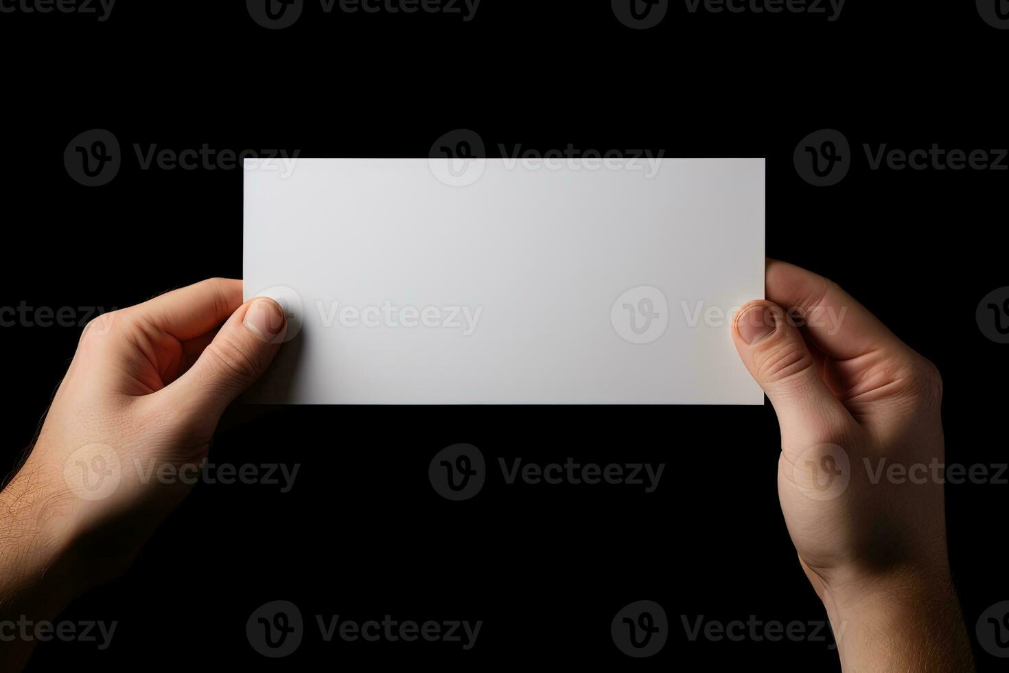 A human hand holding a blank sheet of white paper or card isolated on black background. ai generated photo