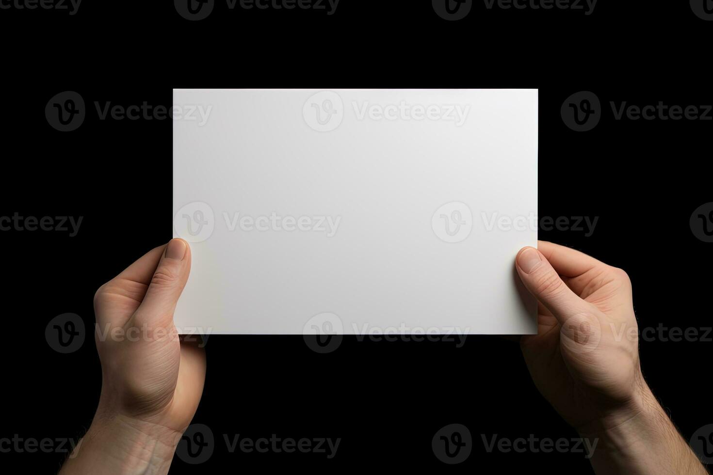 A human hand holding a blank sheet of white paper or card isolated on black background. ai generated photo