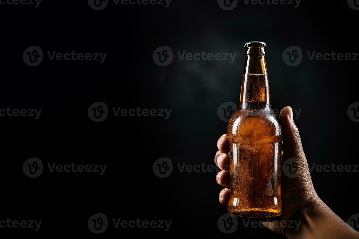 a male hand holding up a bottle of beer isolated on a black background with copy space. ai generated photo