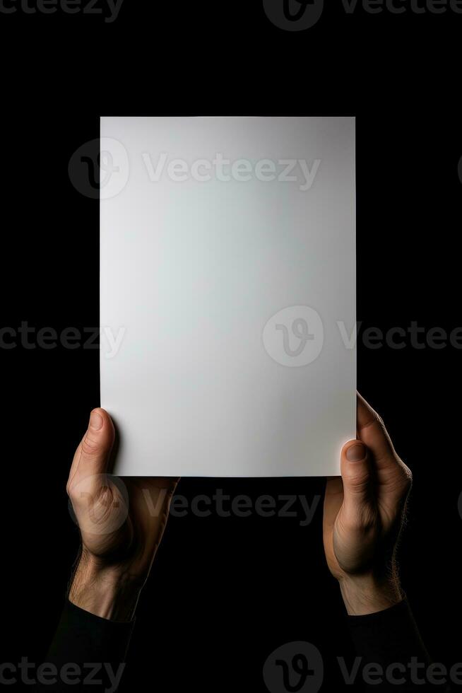 A human hand holding a blank sheet of white paper or card isolated on black background. ai generated photo