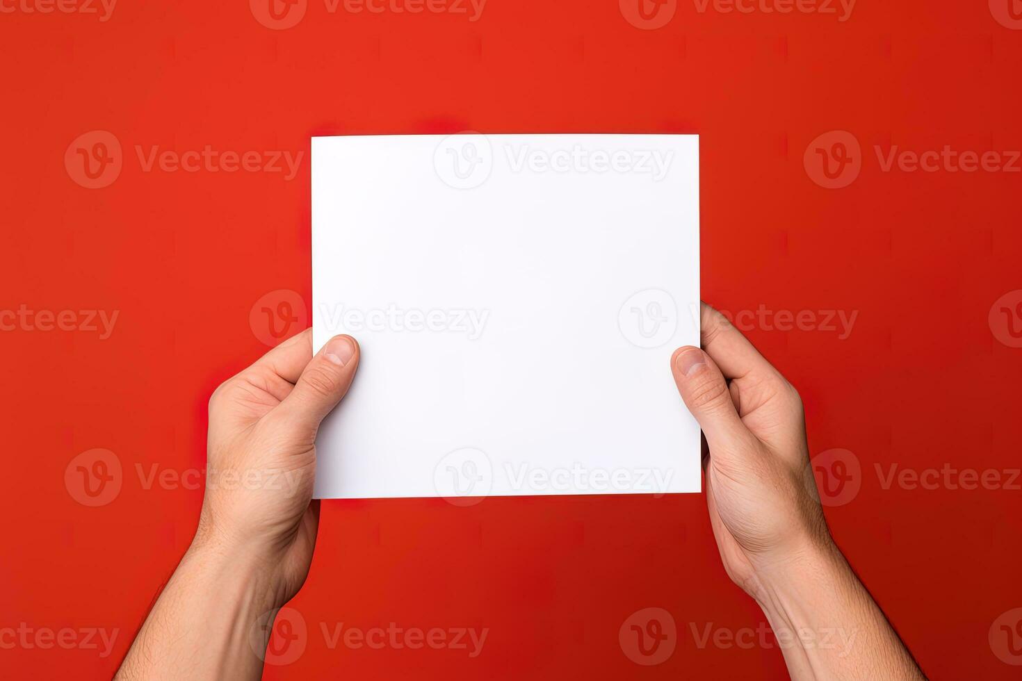 A human hand holding a blank sheet of white paper or card isolated on red background. ai generated photo