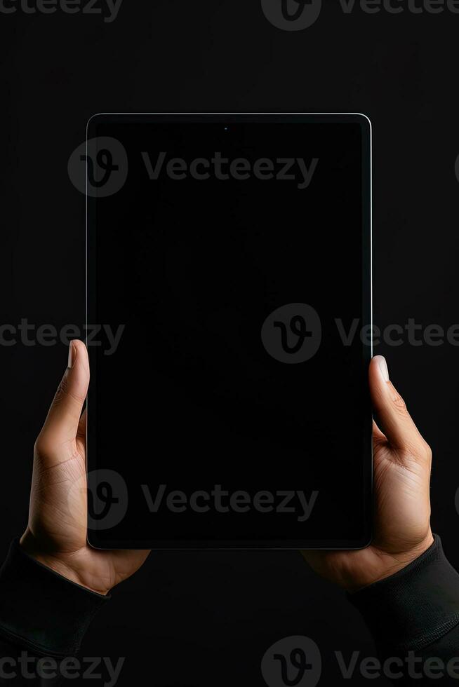Hand holding tablet with mockup blank screen isolated on black background. ai generated photo
