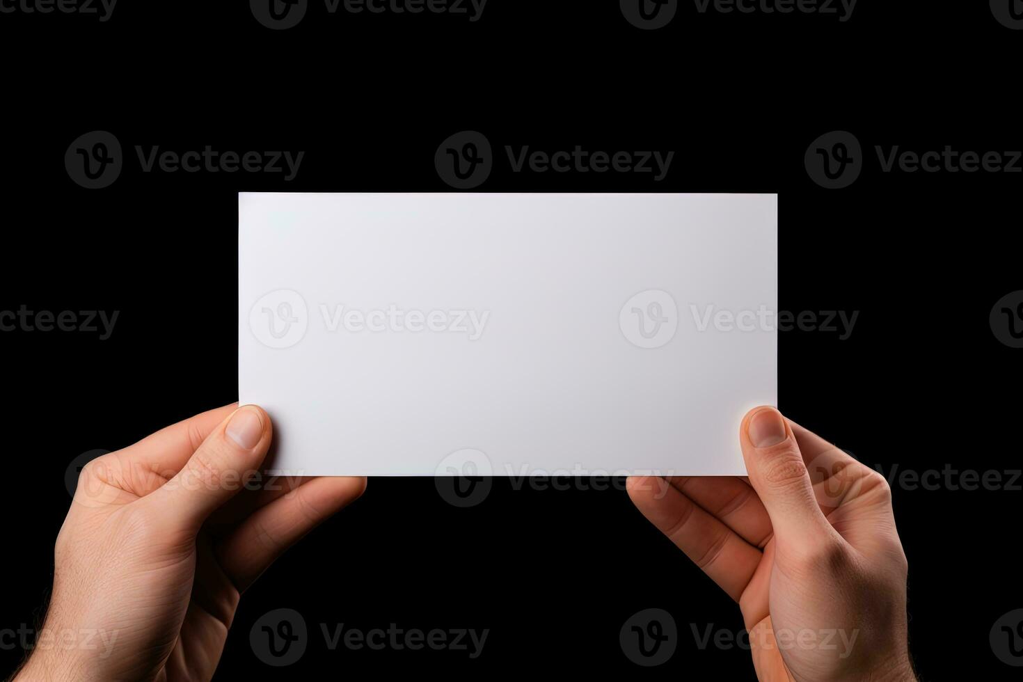 A human hand holding a blank sheet of white paper or card isolated on black background. ai generated photo