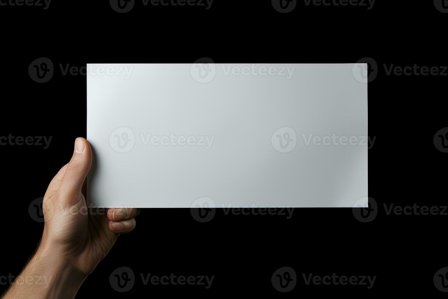 A human hand holding a blank sheet of white paper or card isolated on black background. ai generated photo