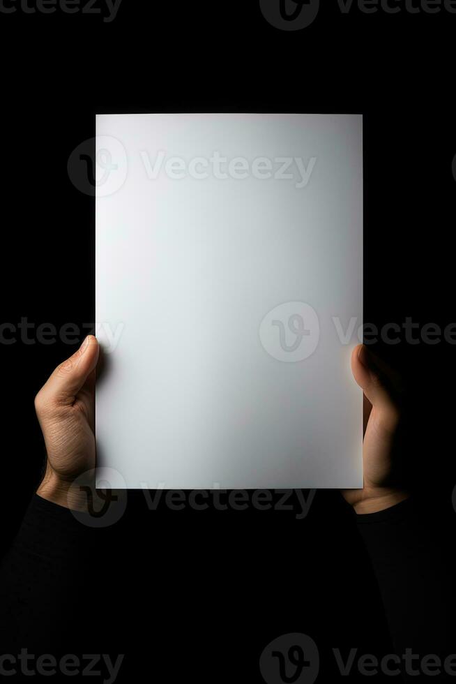 A human hand holding a blank sheet of white paper or card isolated on black background. ai generated photo