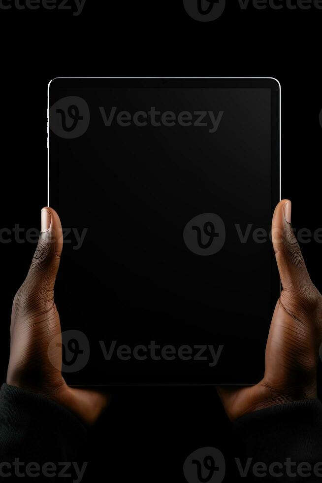 Hand holding tablet with mockup blank screen isolated on black background. ai generated photo