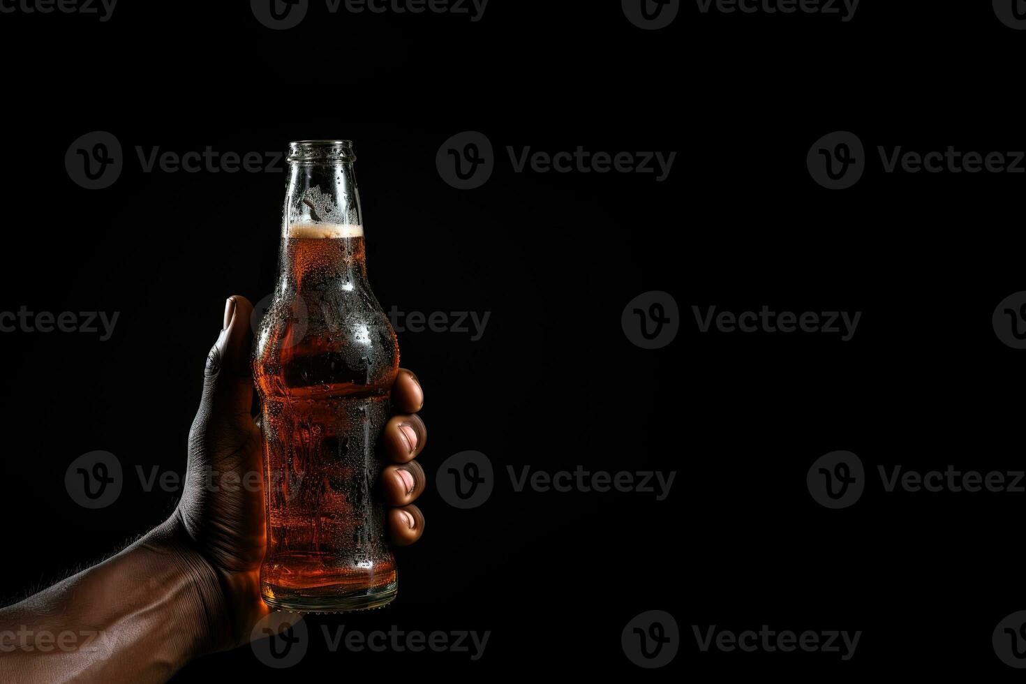 a male hand holding up a bottle of beer isolated on a black background with copy space. ai generated photo