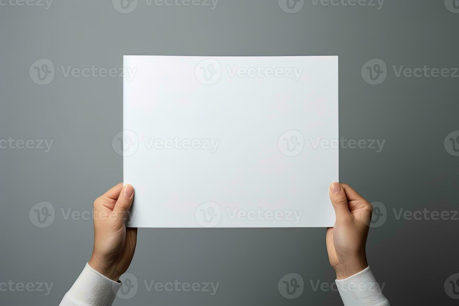 A human hand holding a blank sheet of white paper or card isolated on grey background. ai generated photo